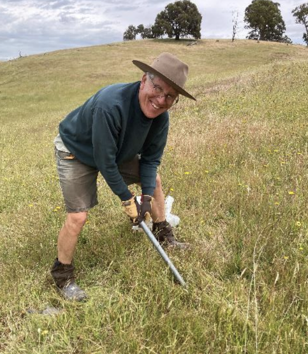 Greg Gorfine Pulling out Invasive Species demonstrating A Rocha Australia's commitment to creation care