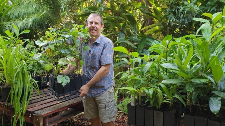 Rowan Shee with native plants being propogated in pots