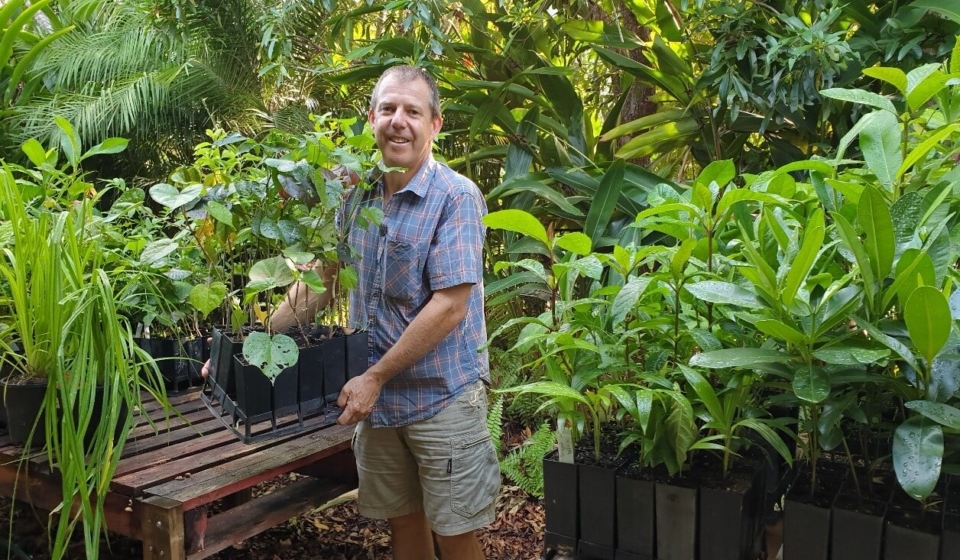 Rowan Shee with native plants being propogated in pots