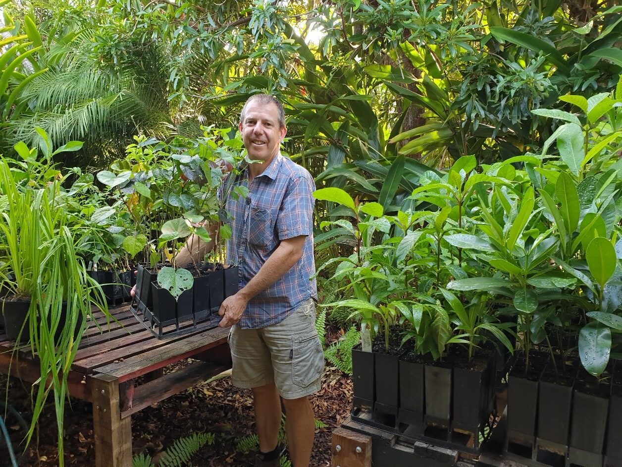 Rowan Shee with native plants being propogated in pots